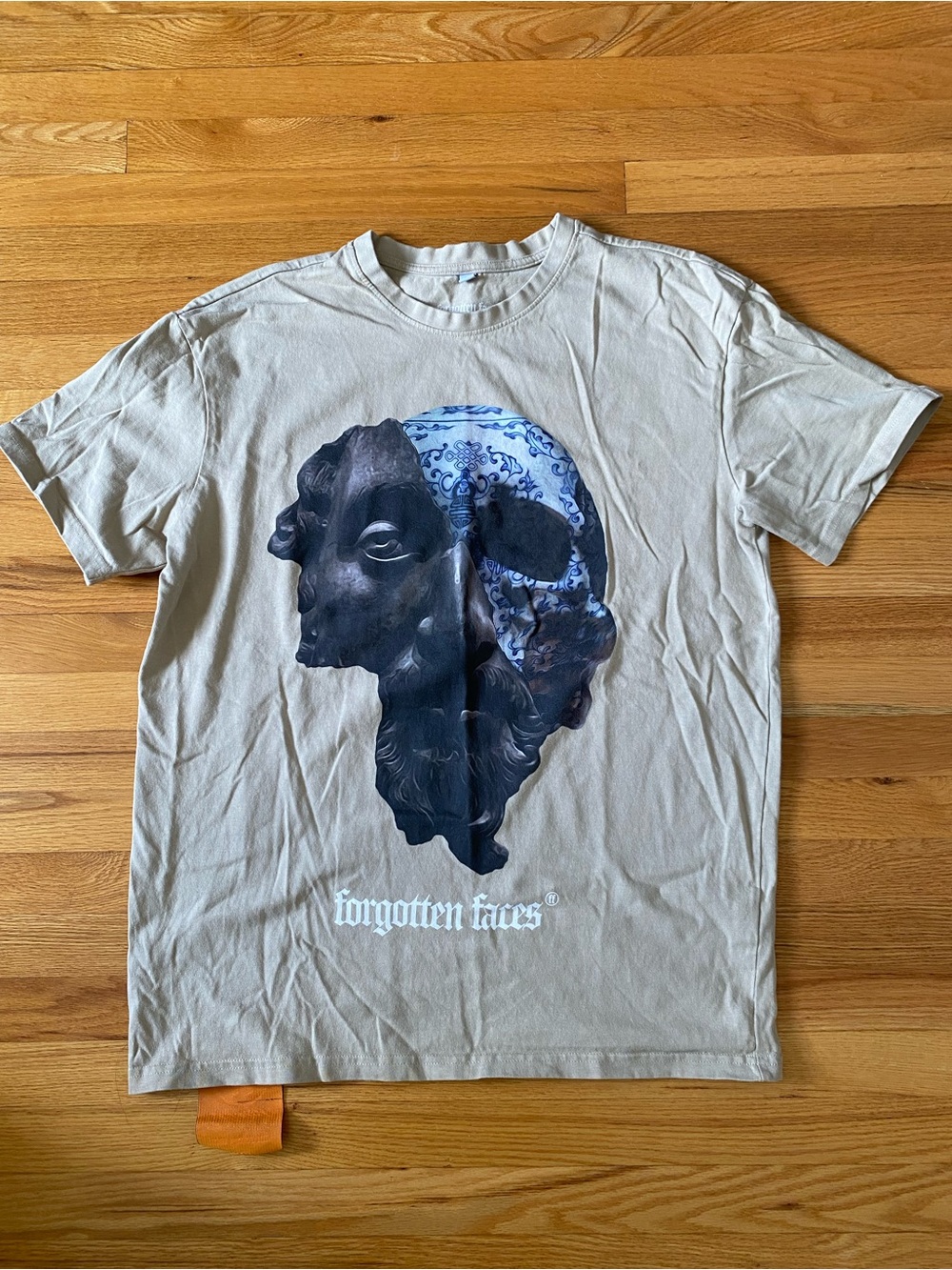 Forgotten Faces Beige Short Sleeve Tee with Blue and Black Graphic